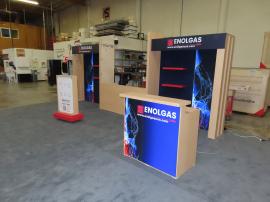 Modified VK-4044 Reconfigurable Inline Exhibit with Shelves, Monitor Mount, Backlit Fabric Graphics, Canopy, Modified MOD-1726 Counter with Locking Storage, and Product Display. Shown w/o LED Video Tiles (Center Section)